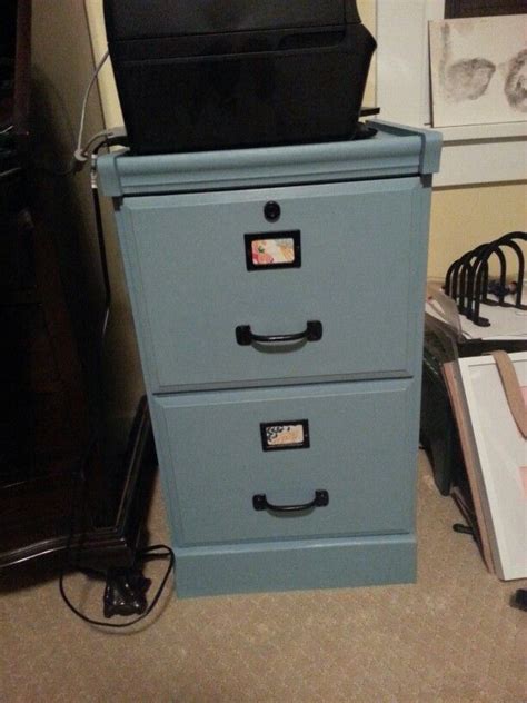 This was the most successful spray paint experience i have ever had. $15 old wooden file cabinet...Some paint, spray painted the hardware black, fabric backing under ...