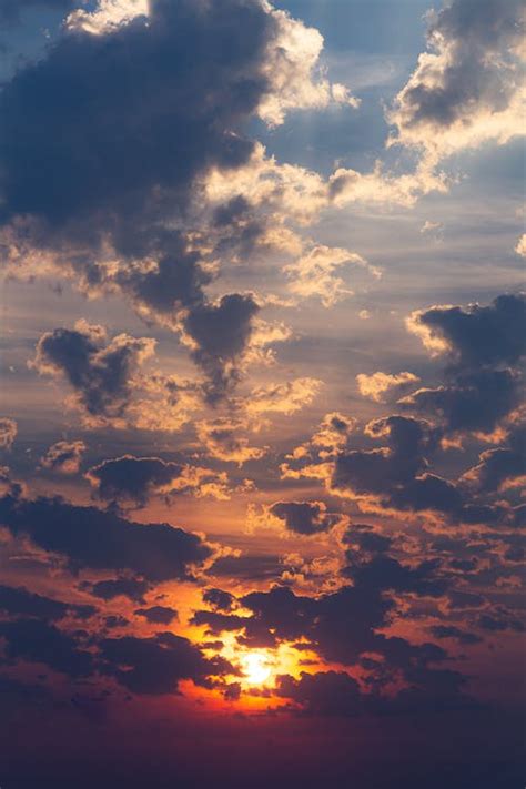 Beautiful Sunset In The Cloudy Sky · Free Stock Photo