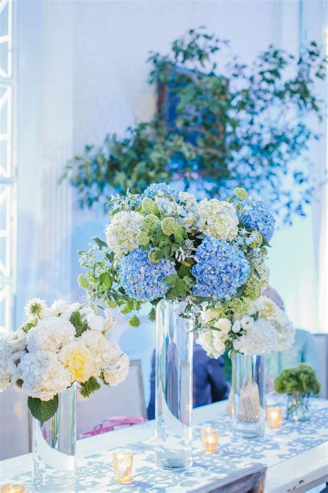 We specialise in wedding decor and exotic flower arrangements. Tall Blue and White Hydrangea Centerpieces | Blue wedding ...