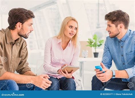 Interesting Discussion Of Three People Stock Image Image Of