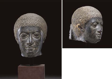 An Egyptian Granite Head Of A Man Ptolemaic Period Circa 2nd 1st