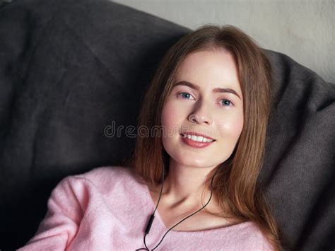 Natural Light Close Up Lifestyle Portrait Of Beautiful Blond Woman With Blue Eyes Long Hair On