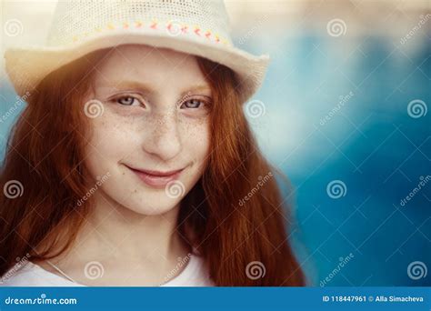 Close Up Facial Portrait Of Beautiful Little Child Girl With Red Hair