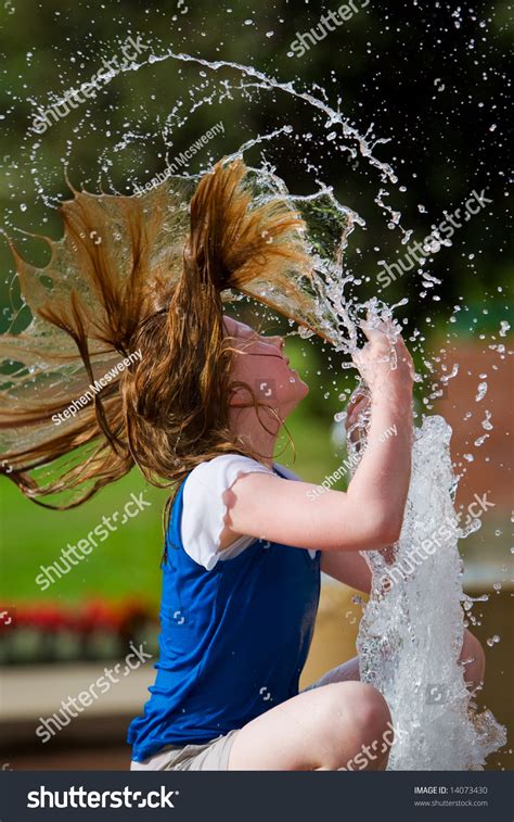 A Young Girl Cooling Off On A Hot Summer Day Stock Photo 14073430