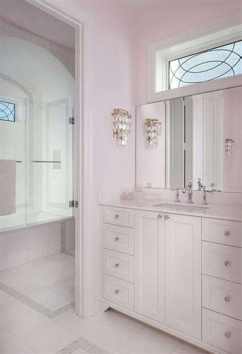 Girly bathroom, cute, elegant and pretty! Pale Pink Girls bathroom with White Capiz Wall Sconce ...