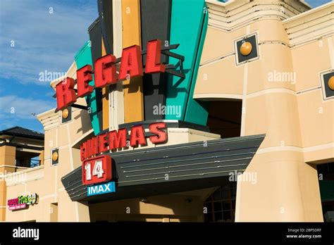 A Logo Sign Outside Of A Regal Cinemas Movie Theater Location In