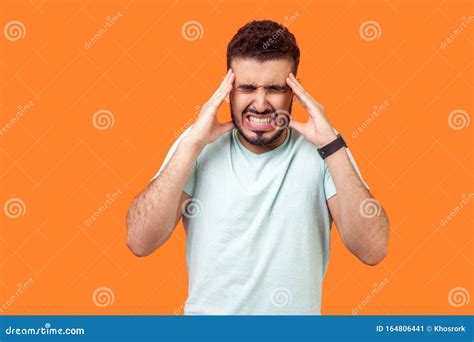 Head Pain Portrait Of Unhealthy Brunette Man Touching His Temples And