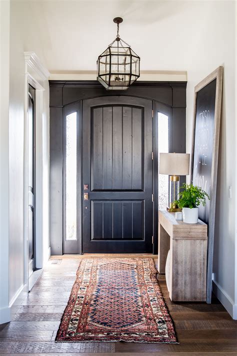 Entryway With Black Front Door And A Kilim Rug Interiors Pinterest