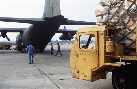 A K Loader Maneuvers Behind A 357th Tactical Airlift Squadron C 130h