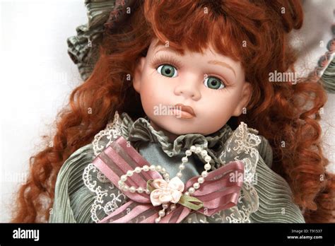 A Modern Replica Of A Victorian Porcelain Doll With Red Hair Stock