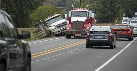 Dump Truck Crash Causes Partial Highway 20 Closure Spills Gravel Load