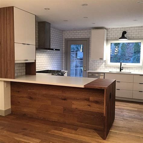 With the farmhouse trend continuing its upswing, butcher block countertops are coming back in style. waterfall butcher block on granite - Google Search in 2020 ...