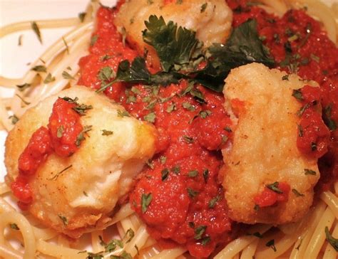 The italian tradition involves family gathering for a ~feast~ of seven seafood dishes, or a few different kinds of fish prepared—you guessed it—in seven different ways. Italian Christmas Eve Baccala Cod with Pasta Marinara Sauce | What's Cookin' Italian Style Cuisine