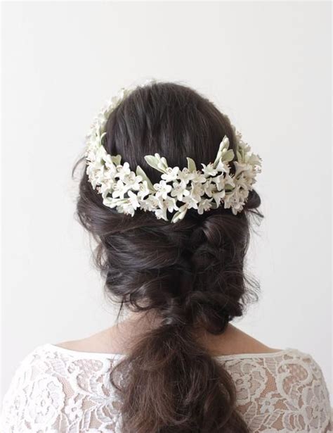 A Woman Wearing A White Flower Crown On Her Head