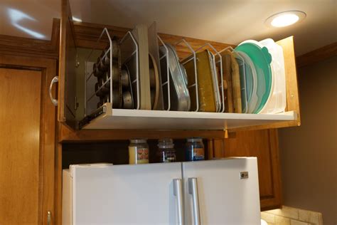 This Is A Pull Out Divider Shelf Behind Two Cabinet Doors Above My
