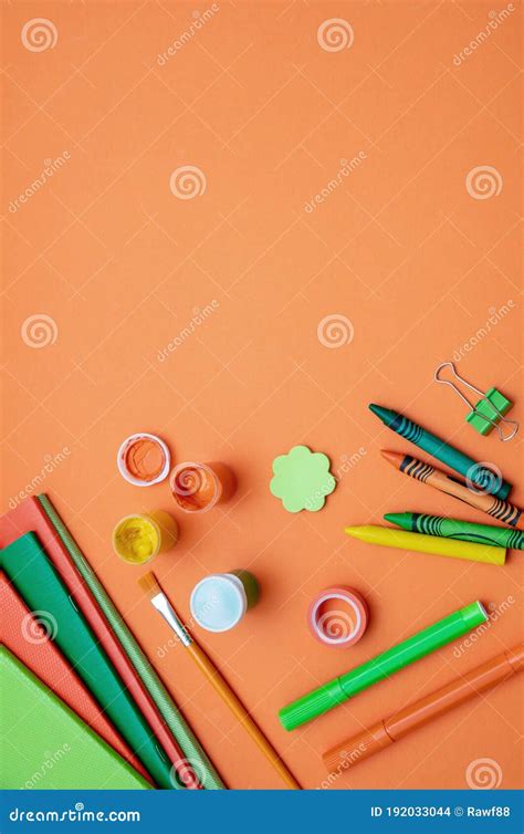 School Supplies On Orange Color Background Top View Copy Space Stock
