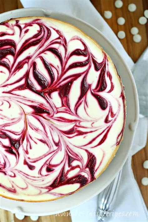 Beat in vanilla and white chocolate. White Chocolate Raspberry Swirl Cheesecake | Let's Dish ...