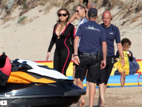 Mariah Carey Suffers Nip Slip After Her Plunging Bikini Struggles To Contain Her Curves