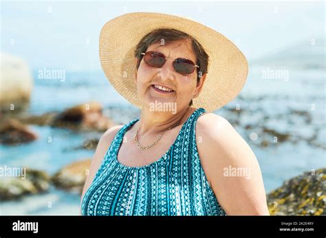 Time To Get My Tan On Shot Of An Attractive Mature Woman Standing