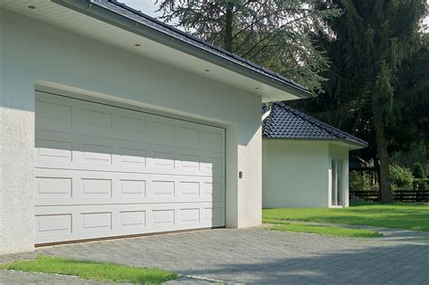A sectional door is made up of horizontal panels which lay parallel with the garage roof when open. JB Doors | Sectional Garage Doors in Nottingham