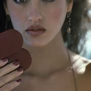 Headshot Of American Model Janice Dickerson As She Holds A Make Up