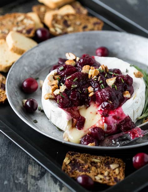 Add the raspberry preserves on top of the brie. Easy Baked Brie recipe w/cranberries & pecans (no pastry ...
