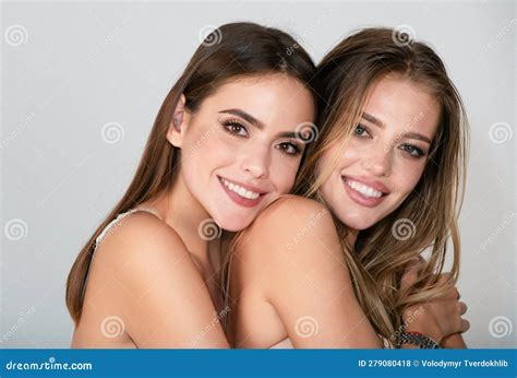 portrait of beautiful sensual lesbian couple hugging romantic girl