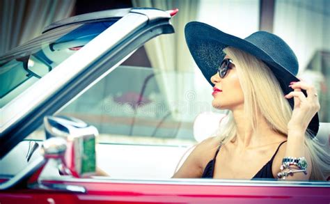 Outdoor Summer Portrait Of Stylish Blonde Vintage Woman Driving A