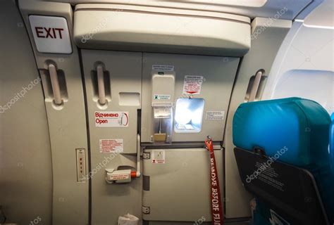 Emergency Exit Door In Airplane Stock Photo By ©kryzhov 55952079