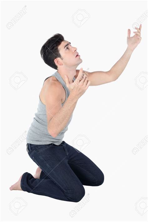 Man Kneeling Down And Looking Up Stock Photo Drawing Reference Poses Pose