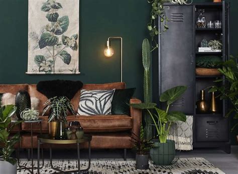 A simple and great way of creating a fresh interior design is by using the color green. Modern Scandinavian Living Room with Green Walls and ...