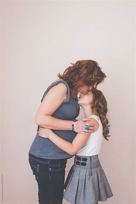 Pregnant Mother Hugging And Kissing Her Daughter By Lea Csontos