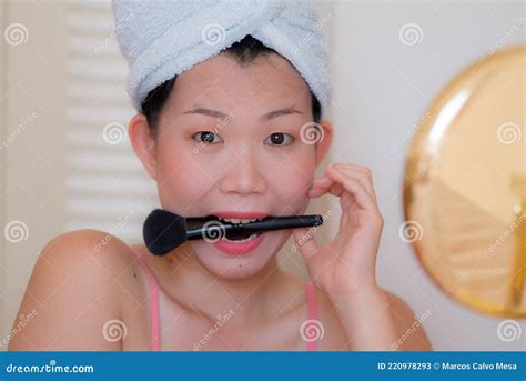 Lifestyle Portrait Of Young Beautiful And Happy Asian Chinese Woman With Head Towel Wrap