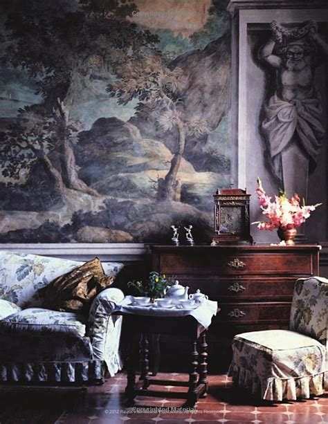 A Living Room Filled With Furniture And A Painting On The Wall