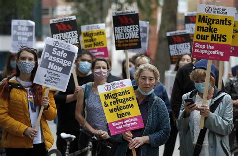 Protestors Hold Placards During A Pro Migrants Protest In London Rci English
