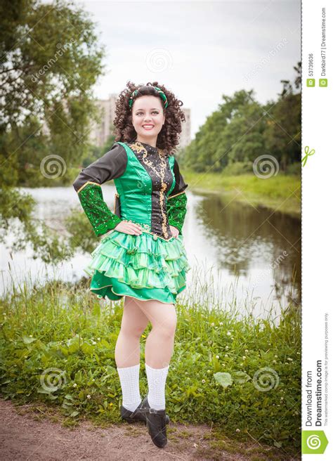 Young Beautiful Girl In Irish Dance Dress And Wig Posing Stock Photo