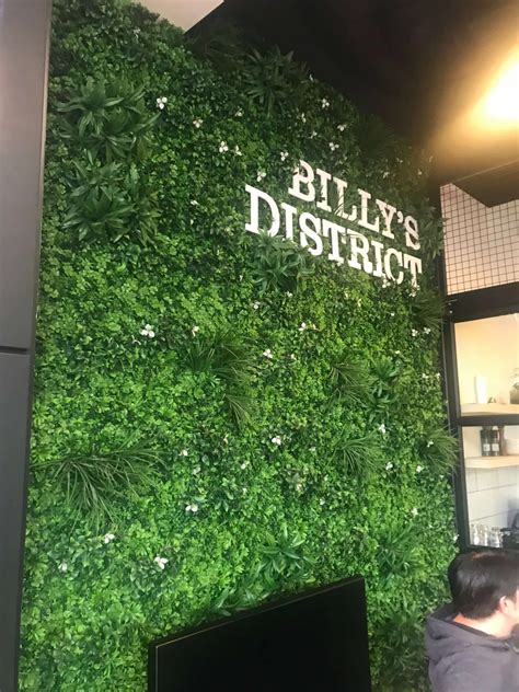 Tall Artificial Green Wall In A Café Designer Plants