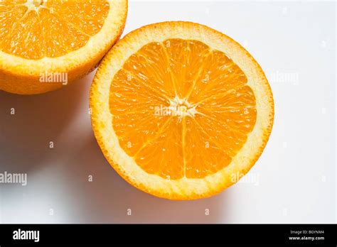 Two Orange Halves On White Background Stock Photo Alamy