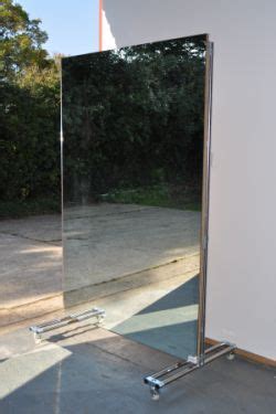 One negative is that it doesn't open. How about a portable mirror, rather than stuck on one wall ...