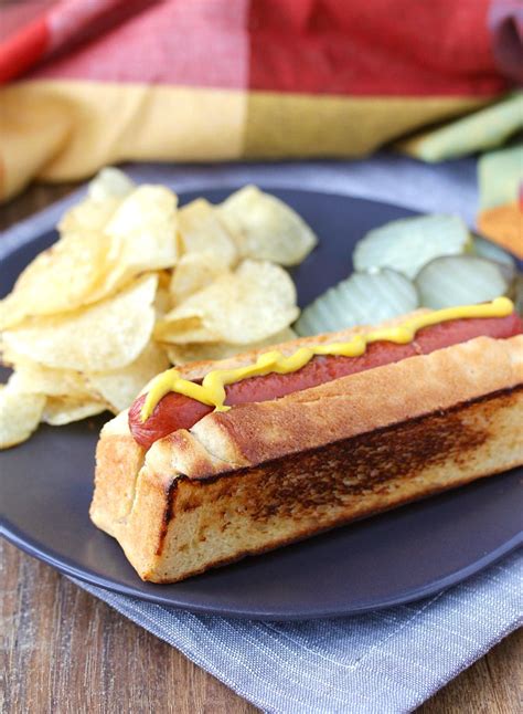 Use a sharp kitchen knife and slit the bun sideways (rim side) slowly n keep rotating the bun to obtain a good cut. New England Hot Dog Buns | Karen's Kitchen Stories