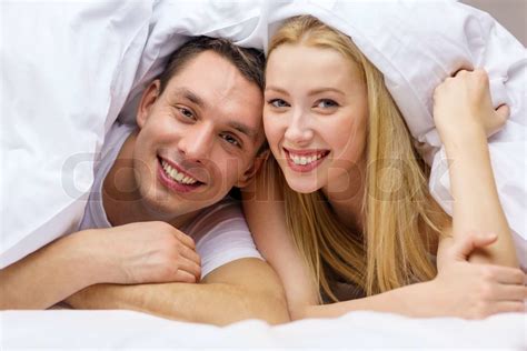 Happy Couple Sleeping In Bed Stock Image Colourbox