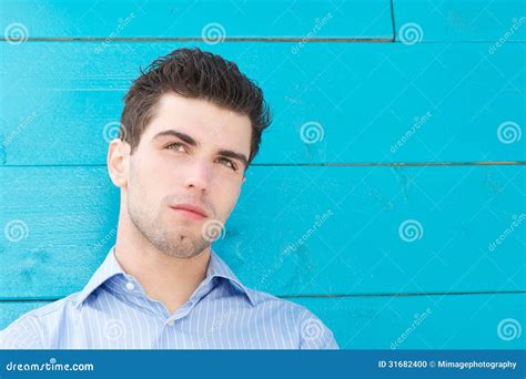 Handsome Young Man With Serious Expression On Face Stock Photo Image