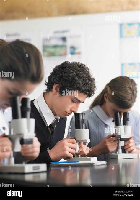 High School Students Using Microscopes In Classroom Stock Photo Alamy