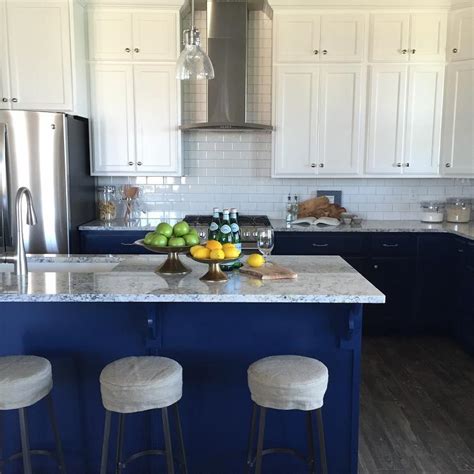 In fact, sometimes painting the lower cabinets in a darker tone… White Upper Cabinets Blue Lower Cabinets - Transitional - Kitchen