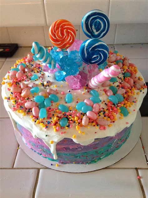 This buttercream has butter and it has whipping cream in it. Cotton candy buttercream cake with candy decorations ...