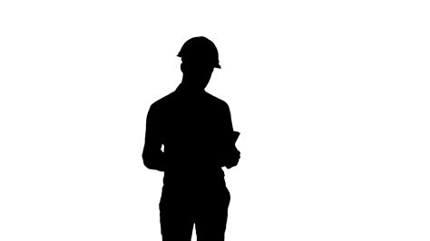 Silhouette Engineer In Hardhat Looking At Construction Plan Stock Video
