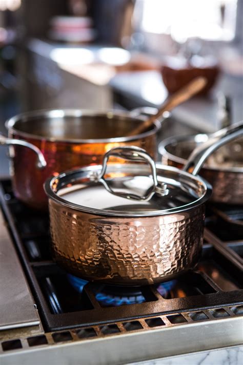 Cropped shot of a group of young friends toasting during a dinner party at a restaurant. Fall Dinner Party Menu Recipes | Crate and Barrel Blog