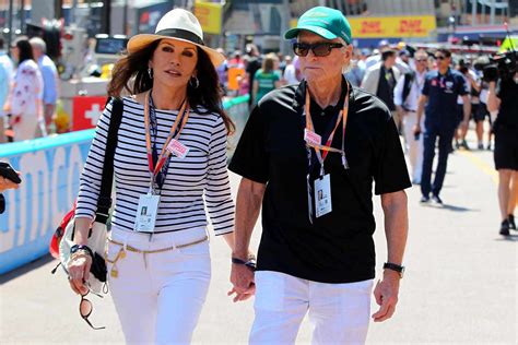 Catherine Zeta Jones And Michael Douglas Hold Hands At Grand Prix