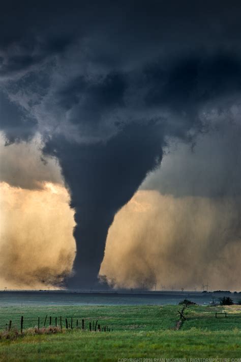 Atmospheric Phenomena — Tornado A Tornado Churns Near Wind Generators