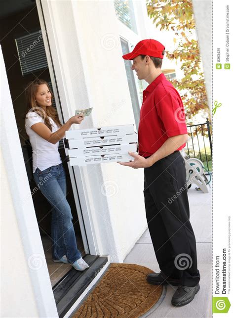 Pizza Delivery Girl Carrying Pizza Boxes Using The Intercom At Door